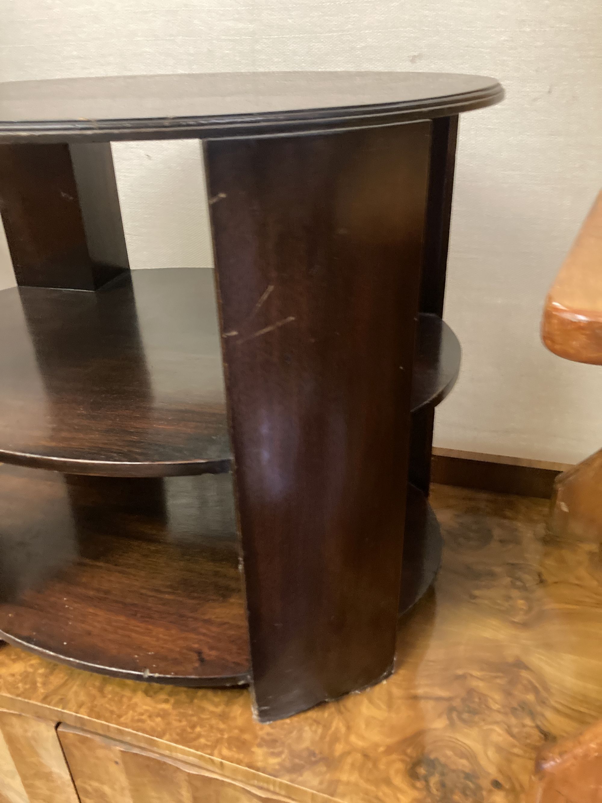 An oval mahogany three tier occasional table, width 64cm depth 50cm height 55cm